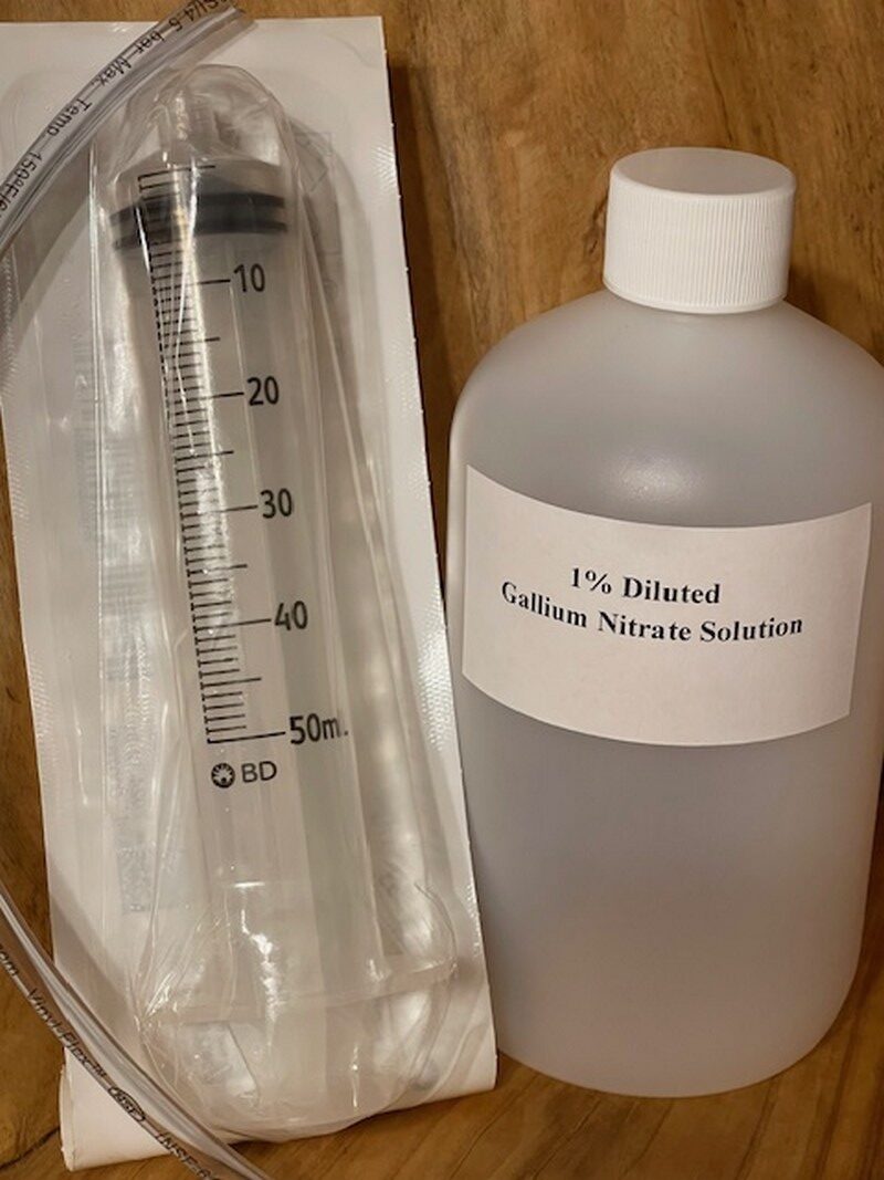 A bottle labeled 17% ethanol with a graduated cylinder nearby.